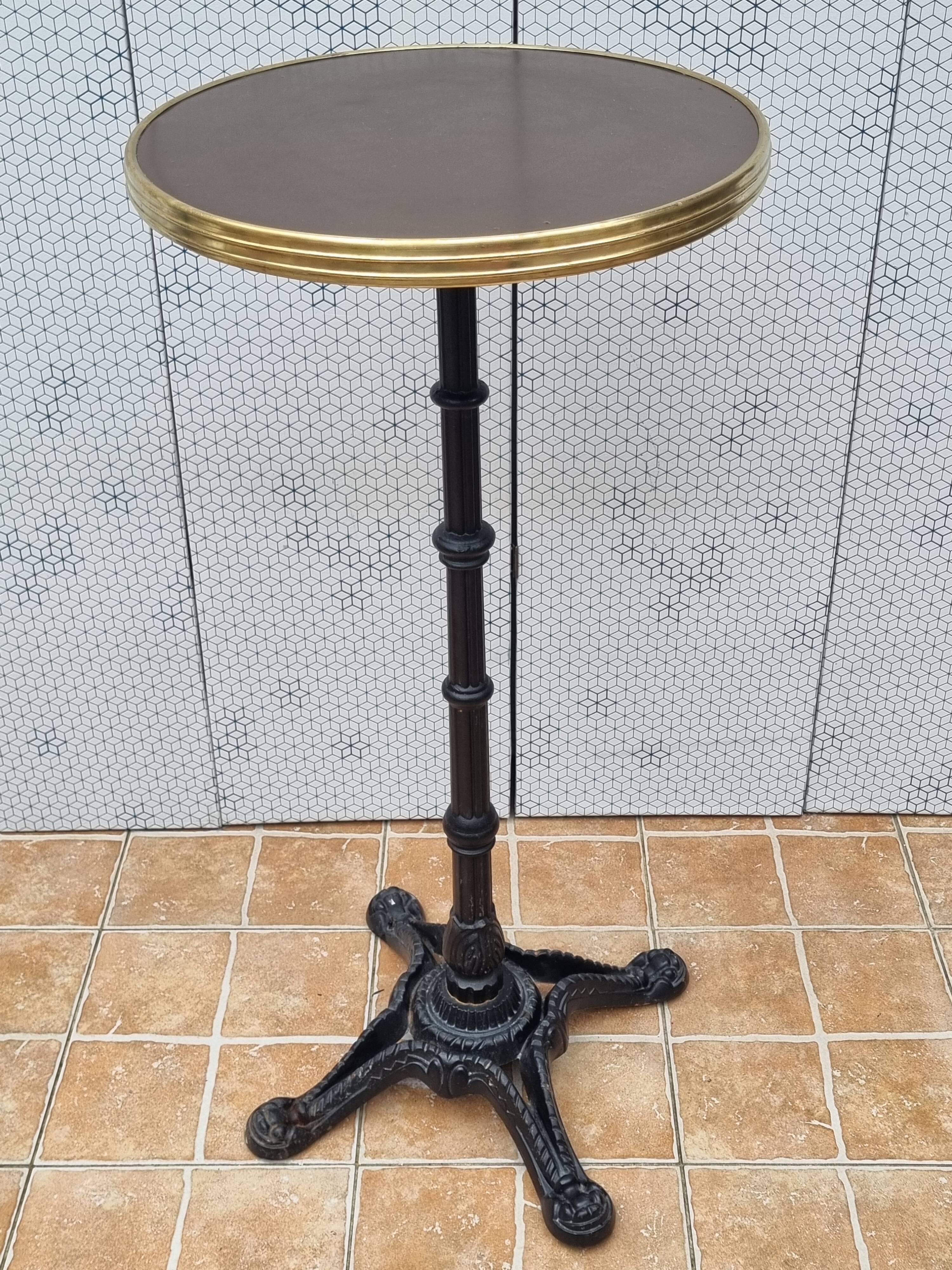 Vintage cast iron and brass "standing" bistro table, 109 cm