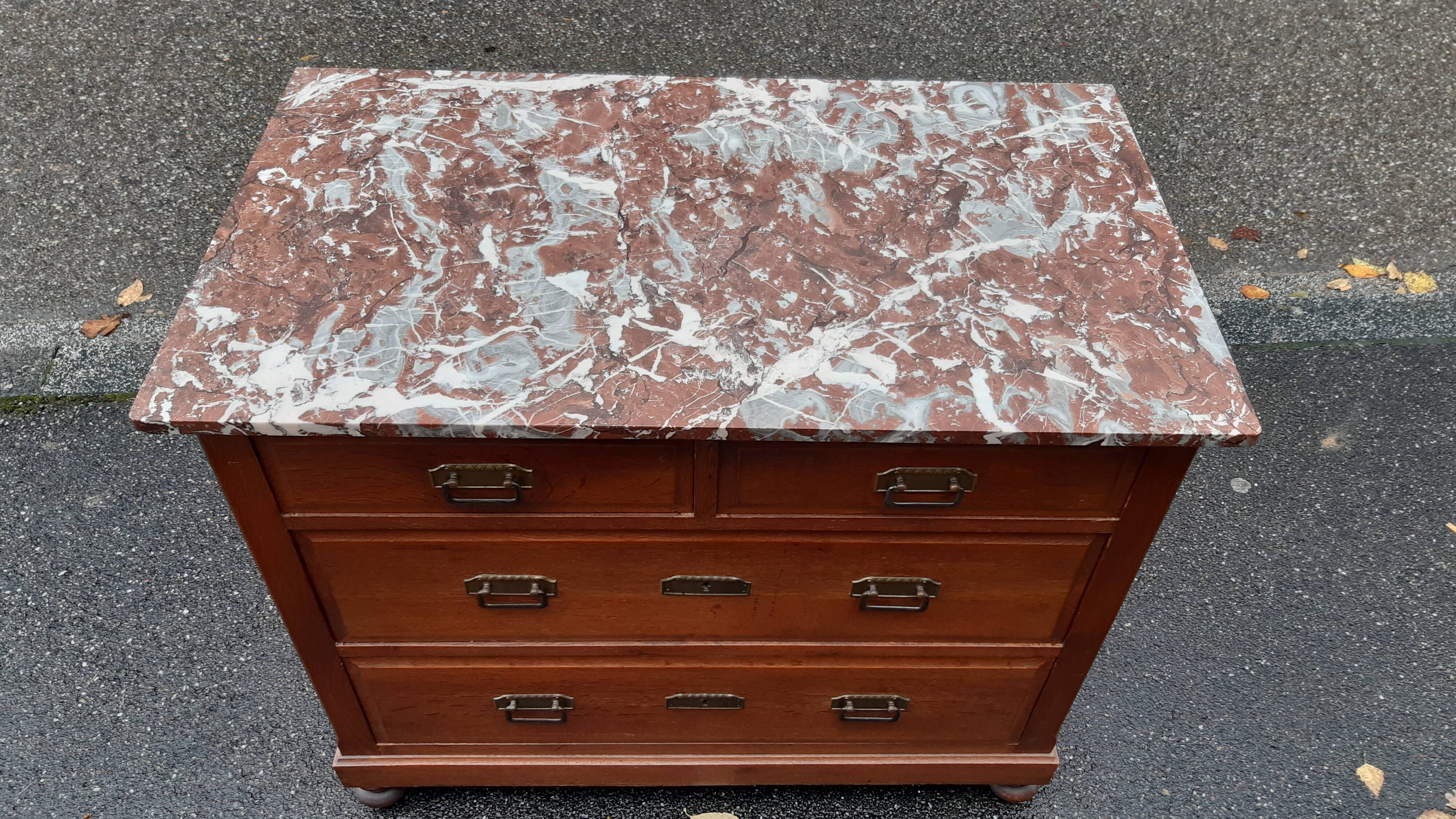 Oak chest of drawers and art deco marble.