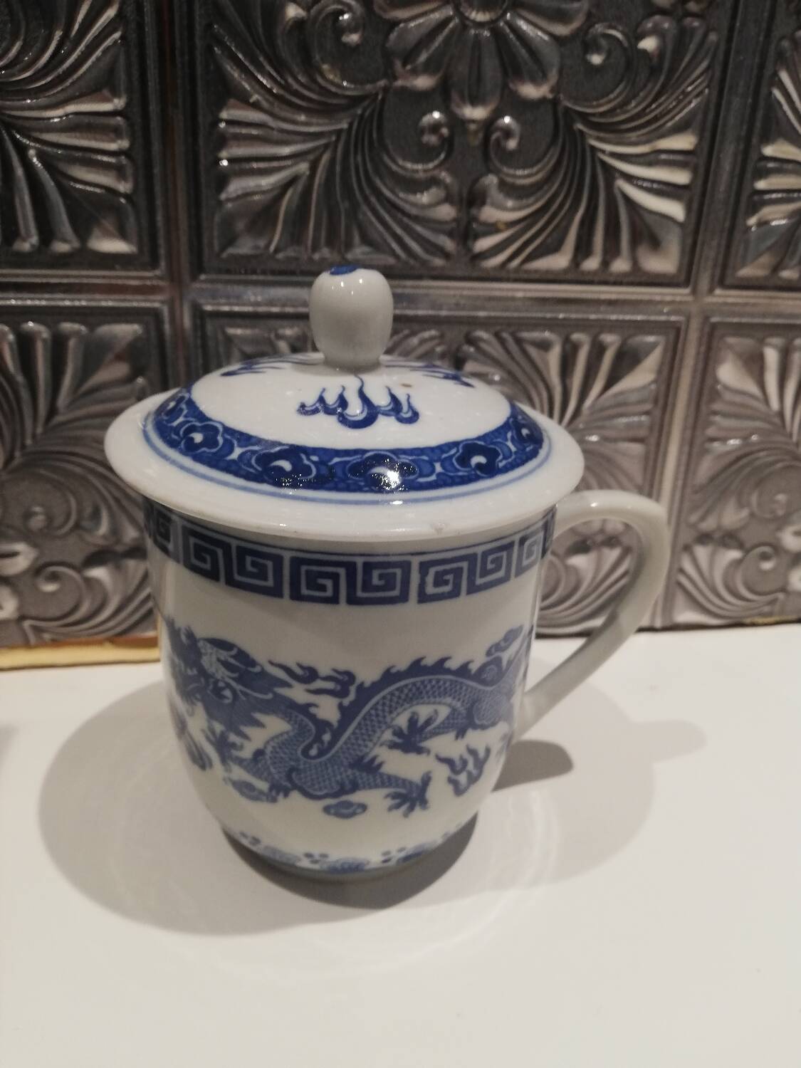 Tea mug with Chinese lid.