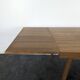 Modernist teak table with 2 extensions.
