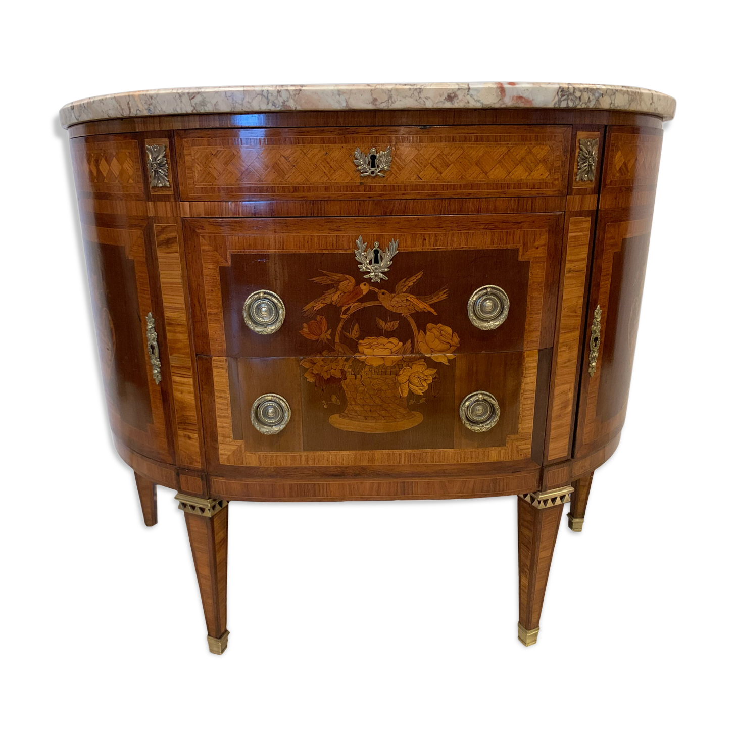 Louis XVI style half-moon chest of drawers in late nineteenth century marquetry