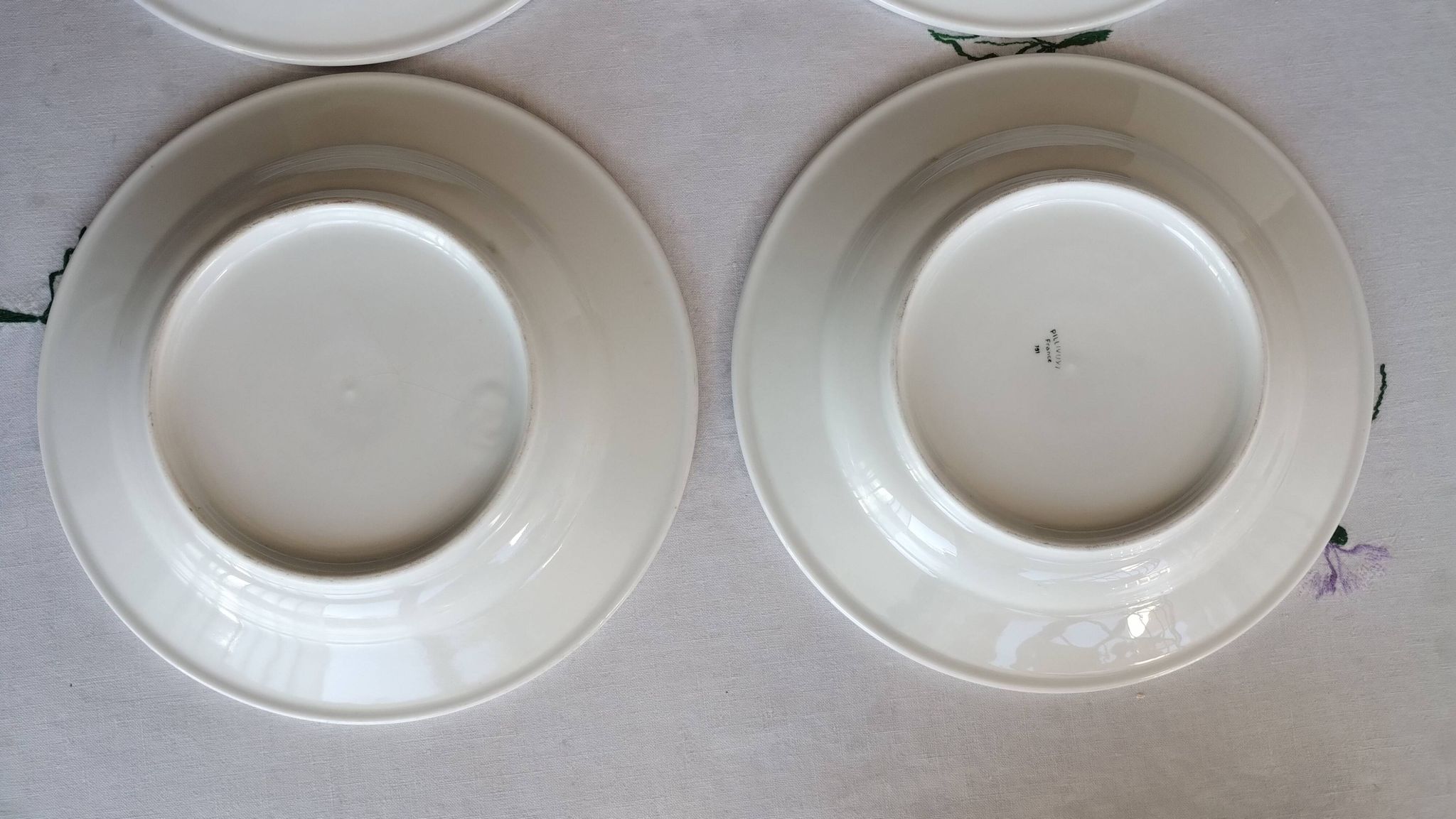 3 Pillivuyt white porcelain dinner plates with blue edging.
