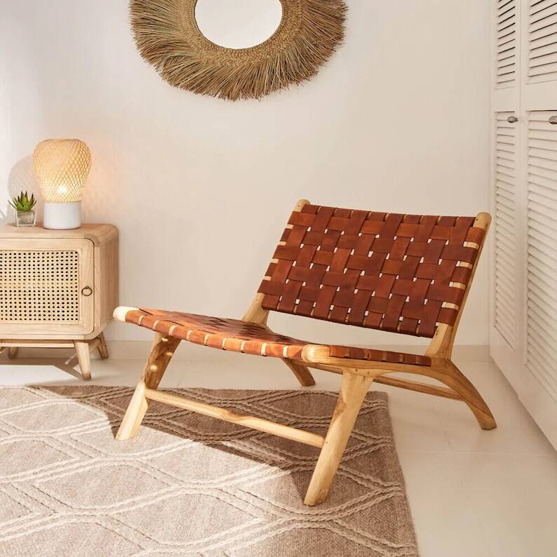 Wooden armchair with leather straps