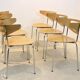 Thonet dining chairs stacked in chrome and beech