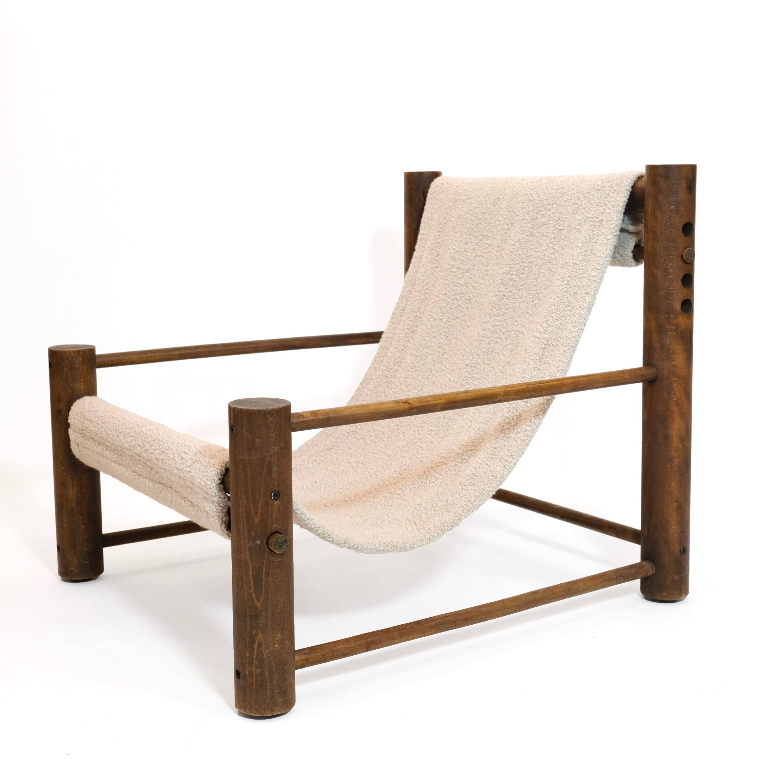 Solid wood armchair with adjustable backrest.