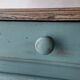 Small vintage side table in sage green patina and solid wood.