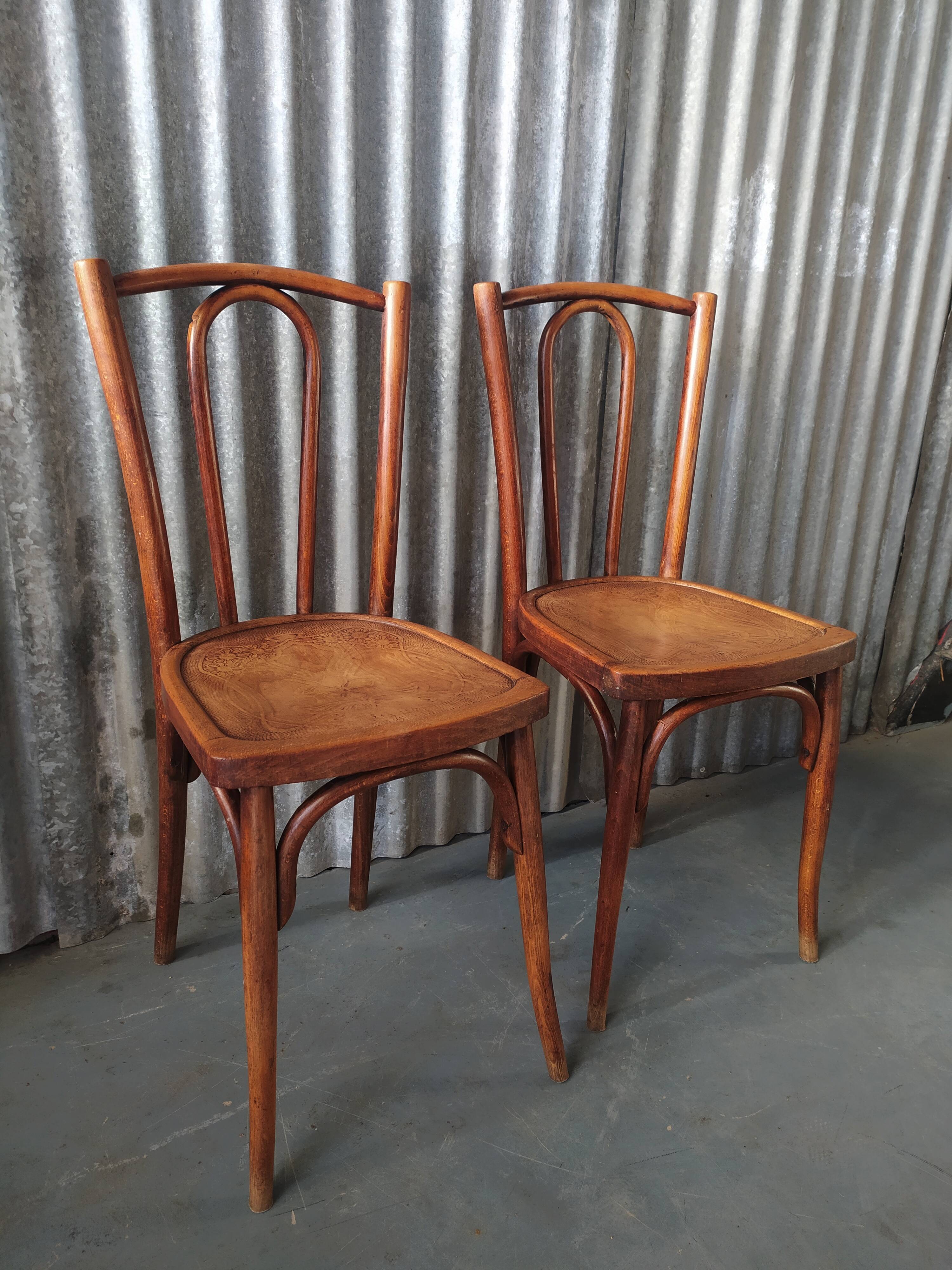 Pair of curved wooden bistro chairs