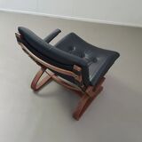 2 x Scandinavian black leather lounge chairs