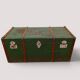 Vintage wooden and metal green travel trunk, circa 1930.
