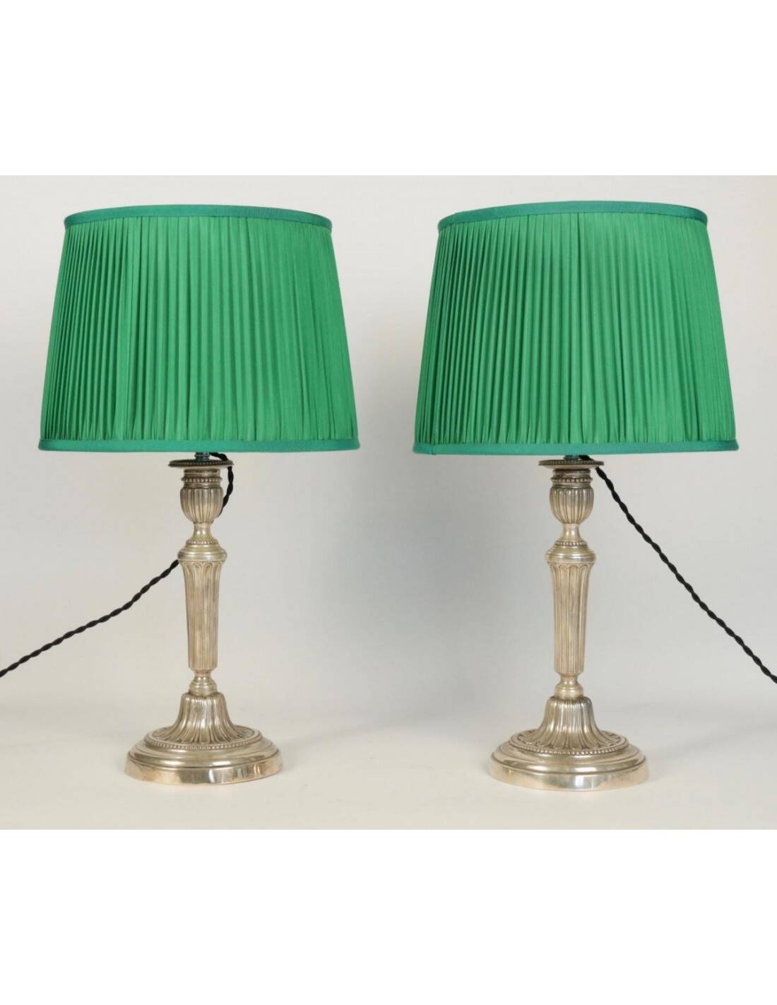 Candlesticks mounted as lamps, silver-plated bronze.