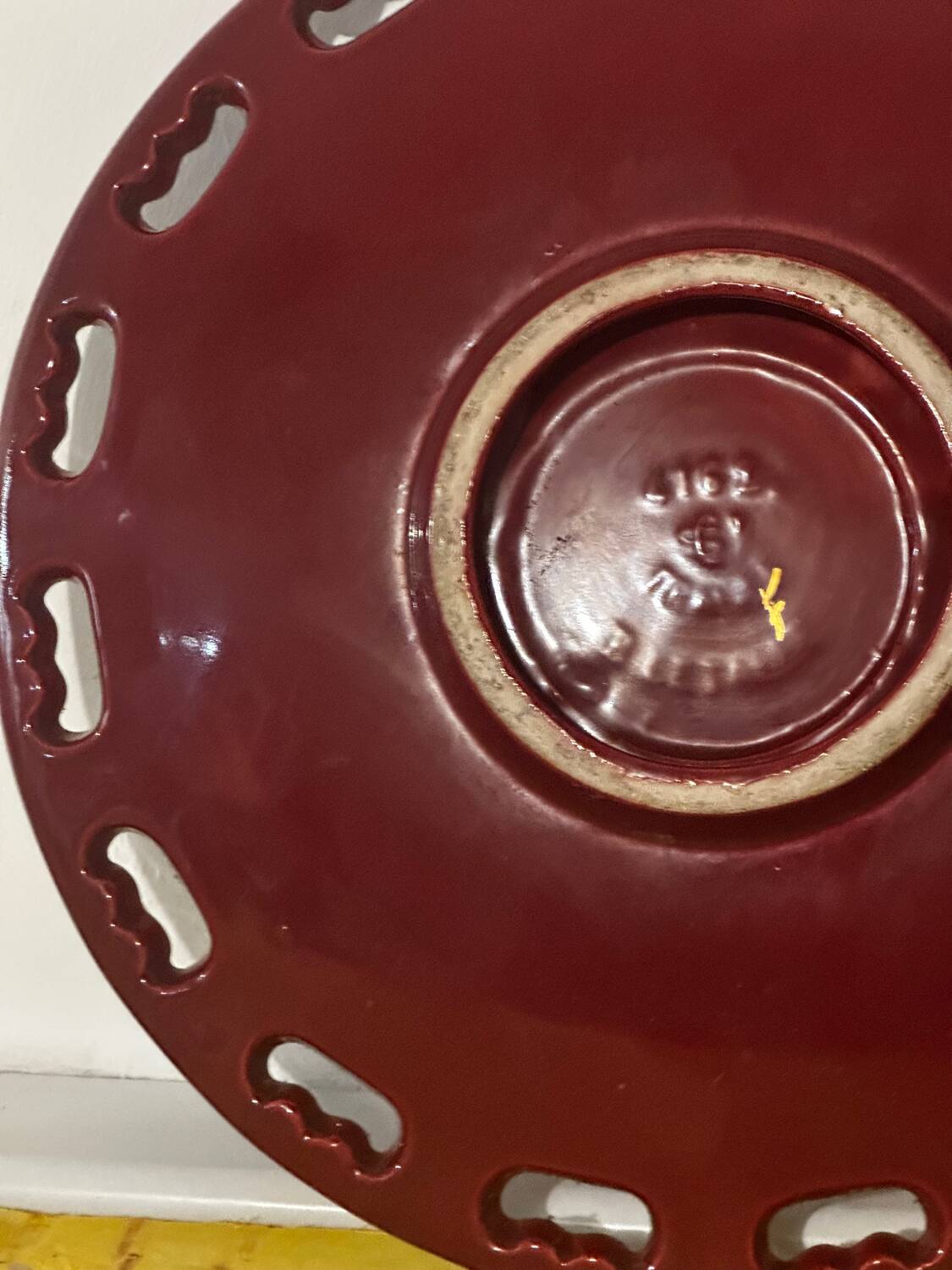 Burgundy and gold openwork plate in ceramic from Saint-Clement, 1950s.