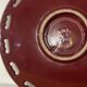 Burgundy and gold openwork plate in ceramic from Saint-Clement, 1950s.