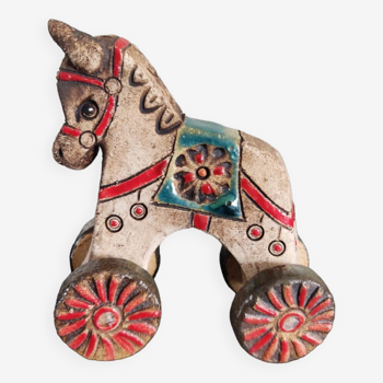 Small ceramic horse on wheels