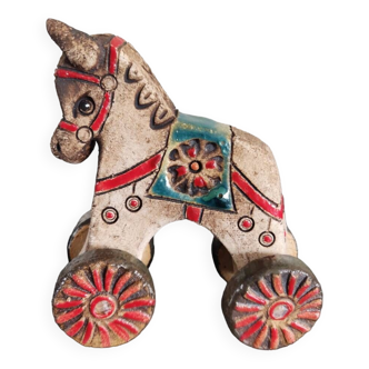 Small ceramic horse on wheels