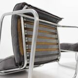 Ensemble fauteuil lounge et repose-pieds en cuir tubulaire chromé - années 1950