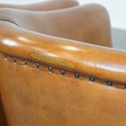 Set of 2 sheep leather club chairs finished with black piping