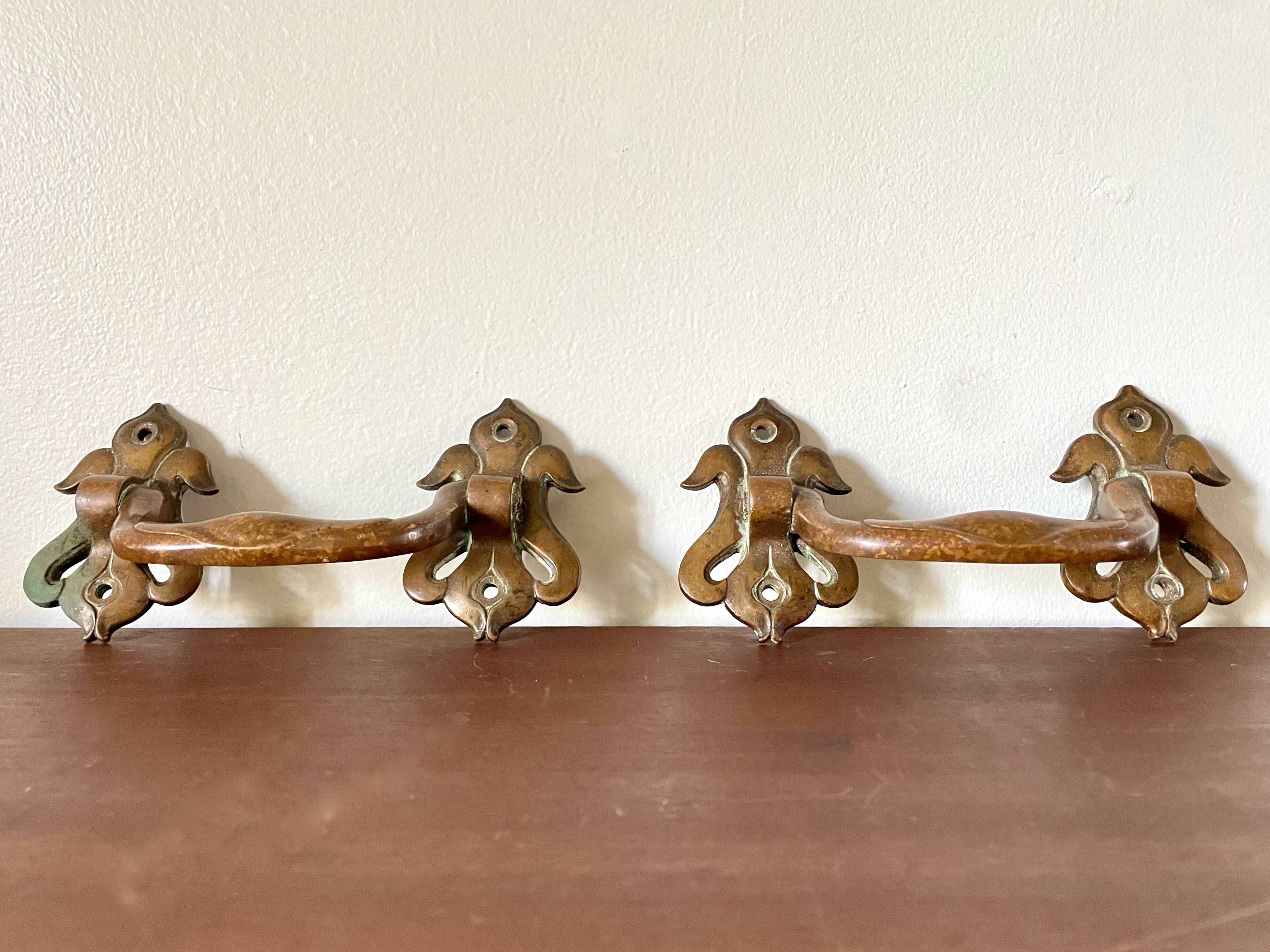 Pair of bronze handles by Emile Muller, 19th century.