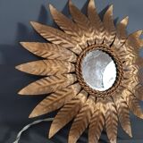 Wall lamp forming sun in gilded brass and with a mirror. Vintage 50s.