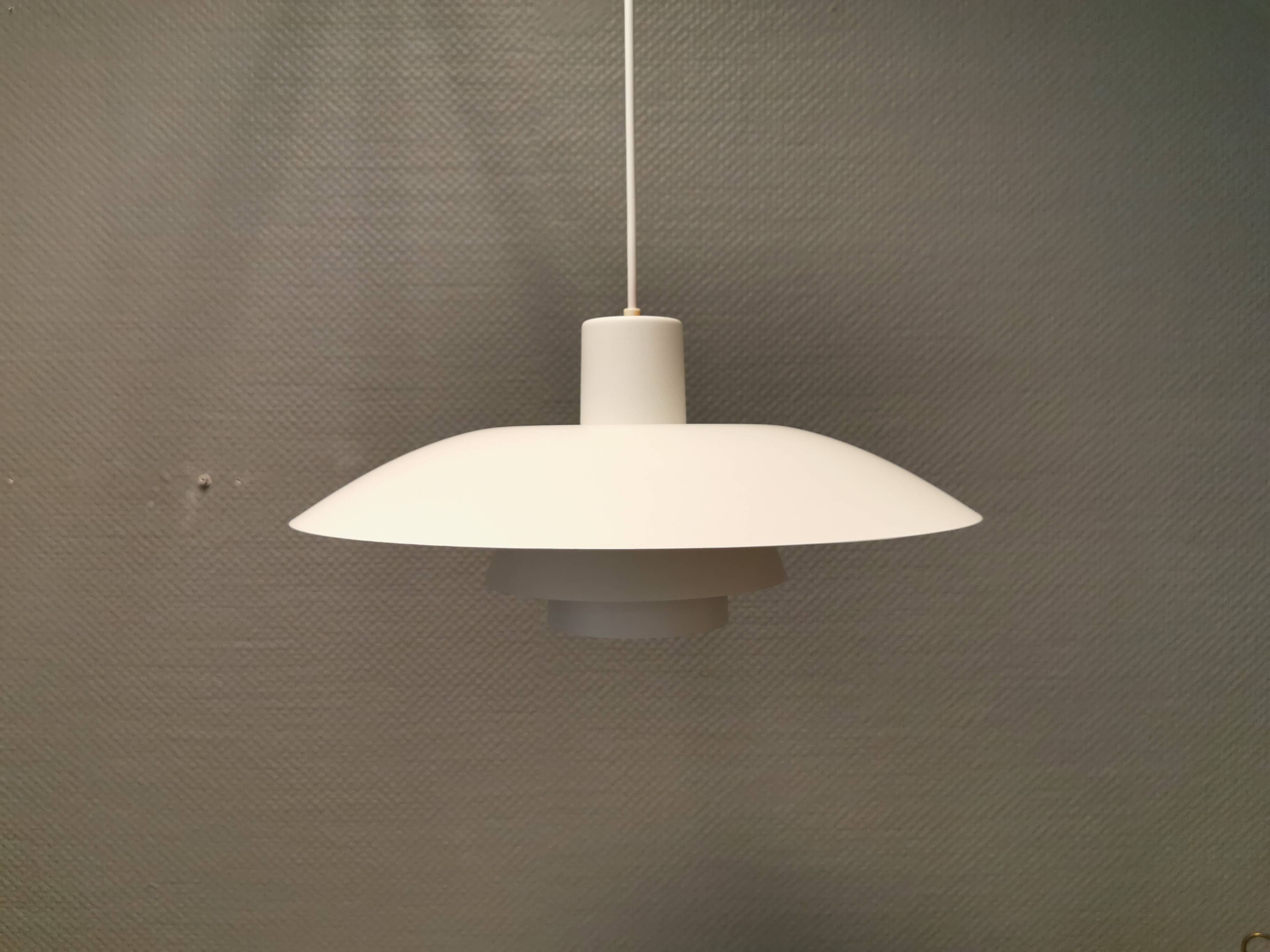Beautiful older PH 4/3 hanging lamp, in white, with original orange suspension.