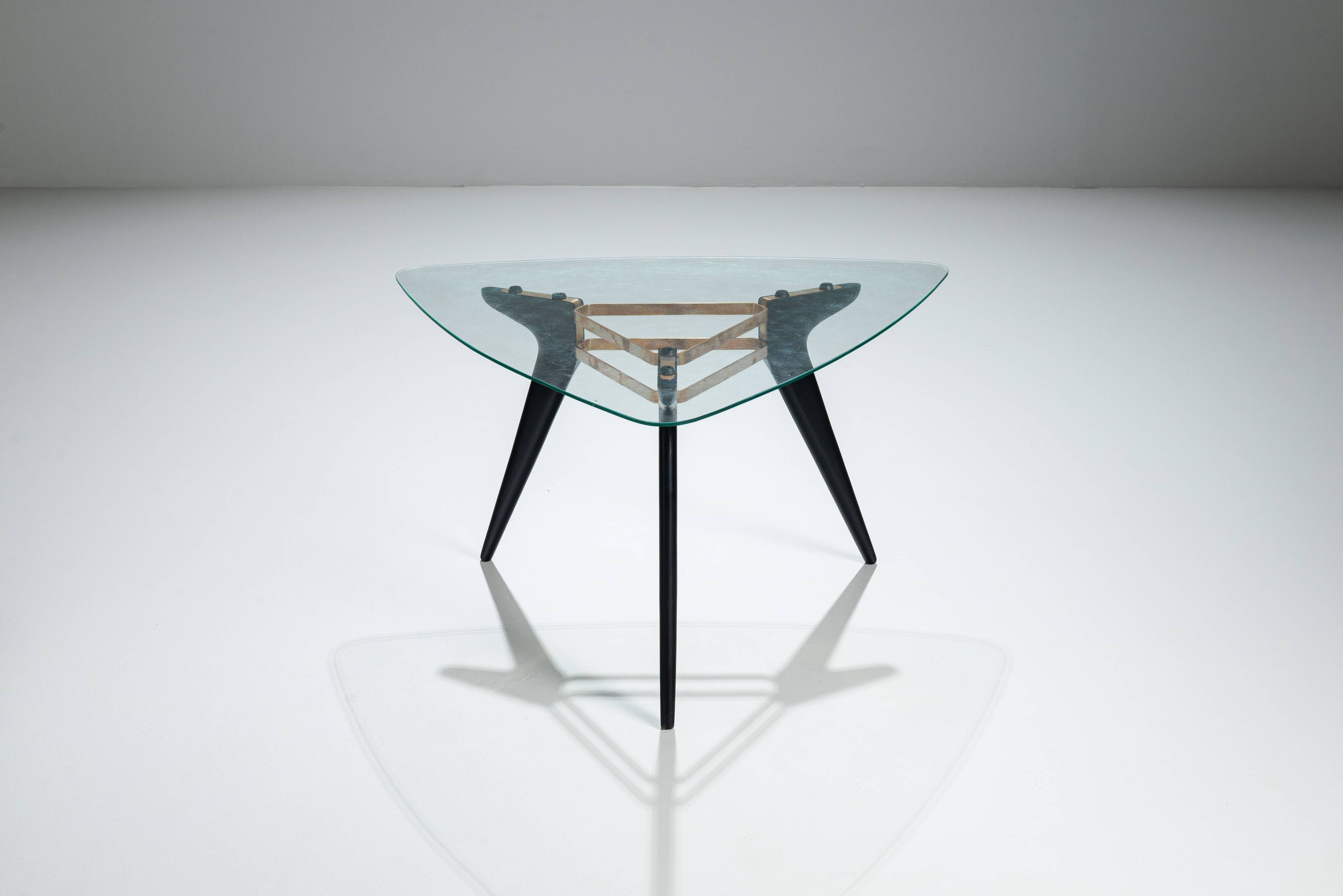 Triangular coffee table in the manner of Alfred Hendrickx