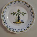 Earthenware plate with bird flute player decoration
