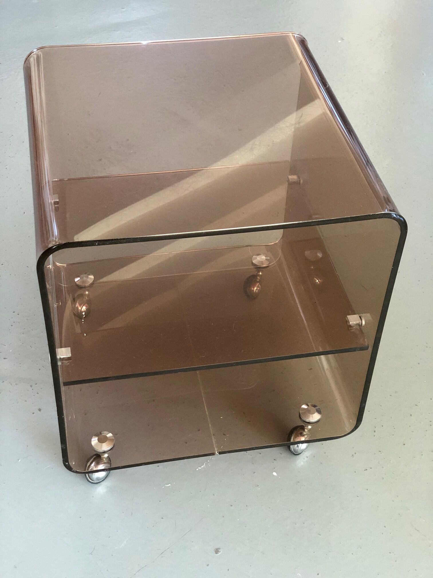 Served on wheels in smoked brown plexiglass 70s.