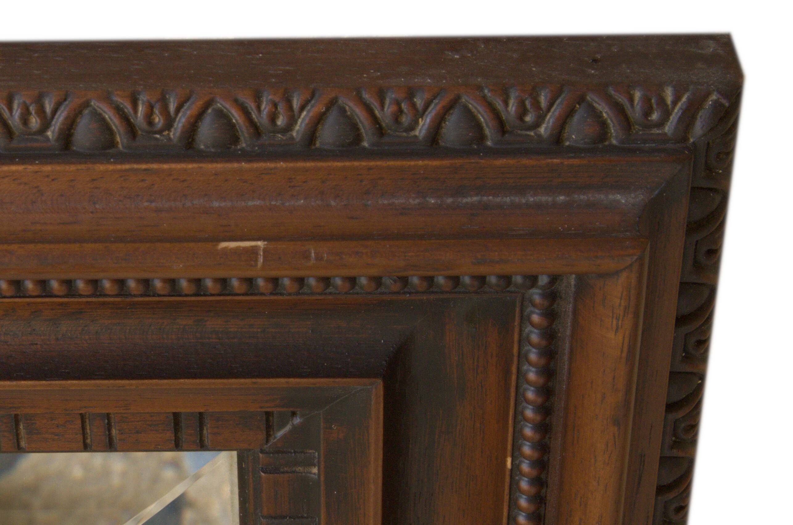 Vertical mirror, bevelled glass and carved wooden frame, 68x88cm