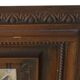 Mirror, bevelled glass and carved wooden frame.