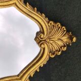 Classic Baroque/Louis XV style mirror. In old gold patinated wood. Palmette/Scroll/Blazon motif decor. Dim 46 x 27 cm