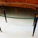 Table basse 1950 ovale en verre acier et laiton