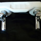 Old ceramic bathroom shelf with 2 chrome bronze faucets