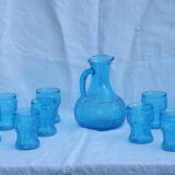 Set of jug and 10 blue glass goblets with floral motifs