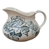 Ceramic water jug with blue floral decoration.