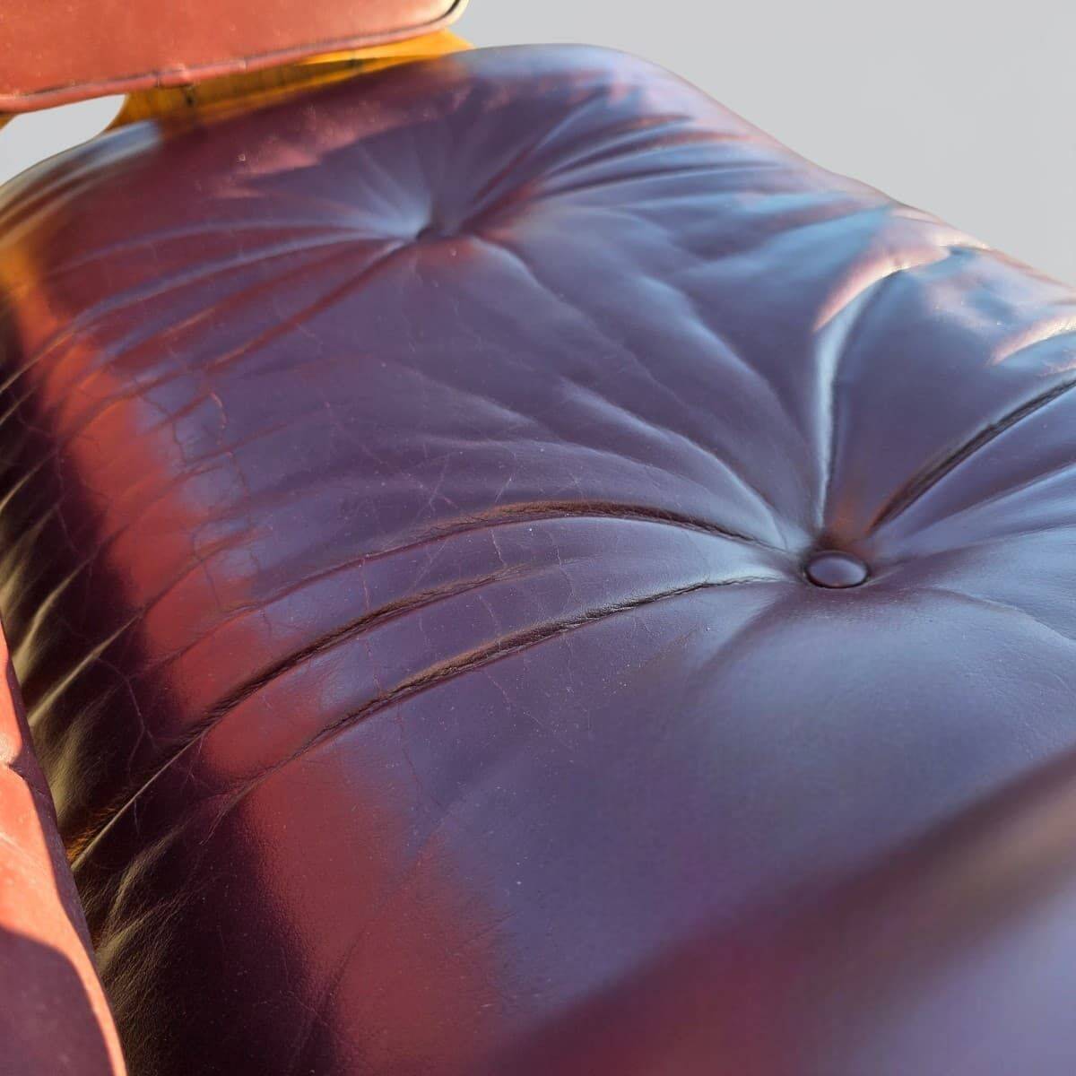 Original Eames lounge chair by Herman Miller in burgundy rosewood.