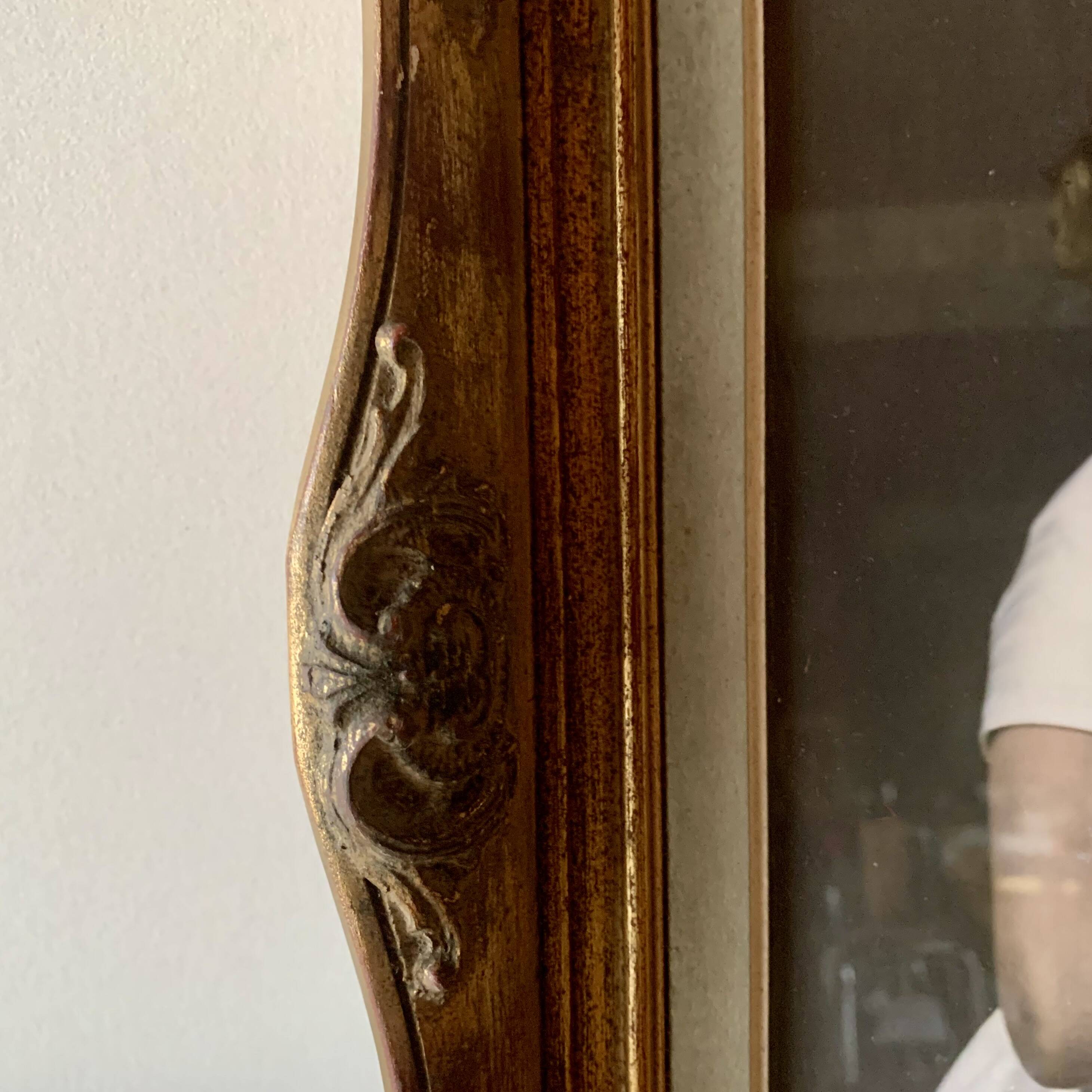 Old gilded carved wooden wall frame