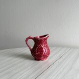 Red ceramic milk jug