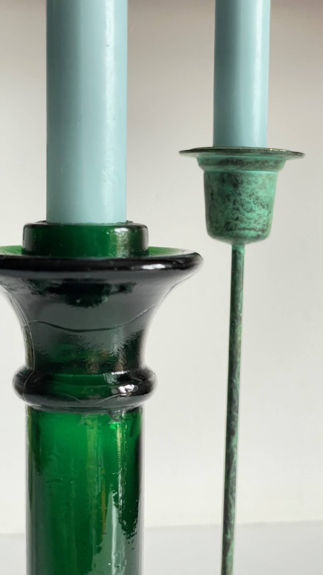 Green glass and metal candle holders