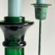 Green glass and metal candle holders