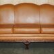 Restored three-seater leather canapé in late Victorian style.