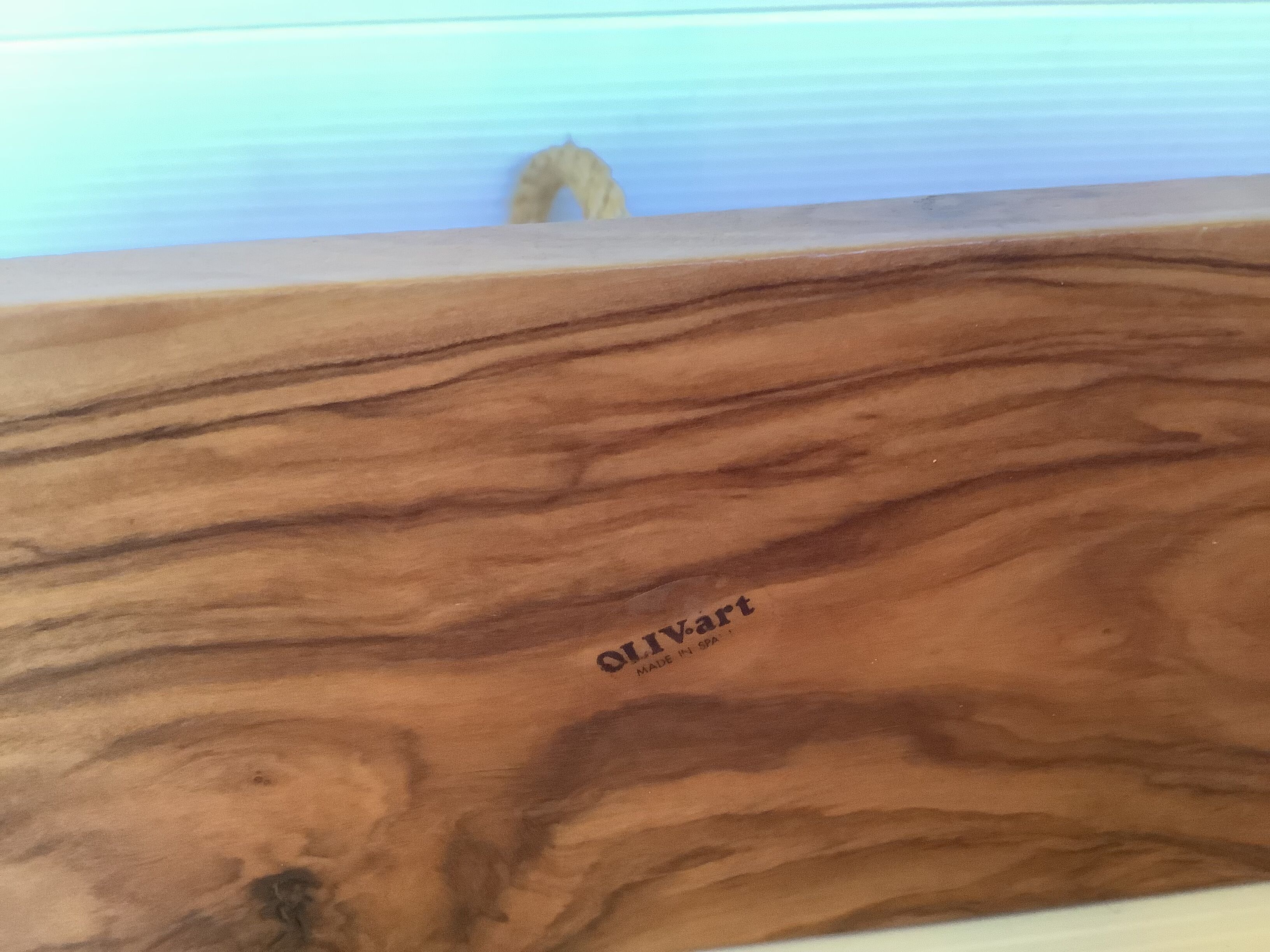 Six olive wood salt and pepper egg cups with their holder.