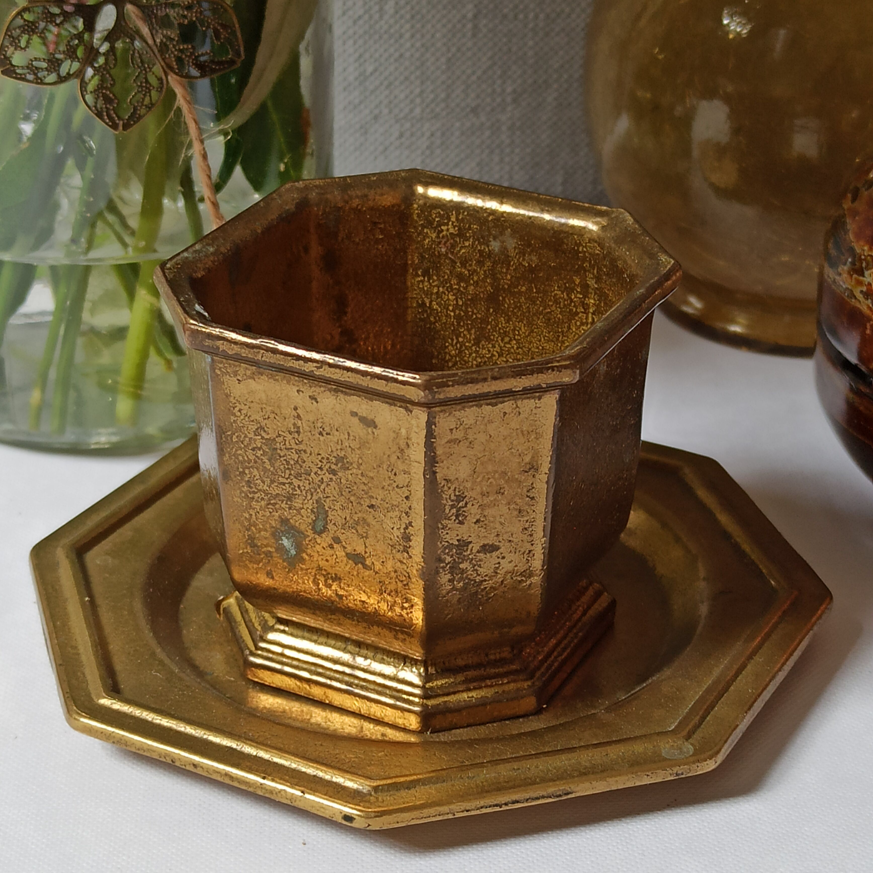 Varnished brass pot on saucer from the 80s