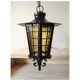 Large hanging lantern in wrought iron and opaque yellow-orange windows