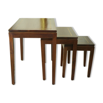 Pull-out tables in mahogany and vintage brass