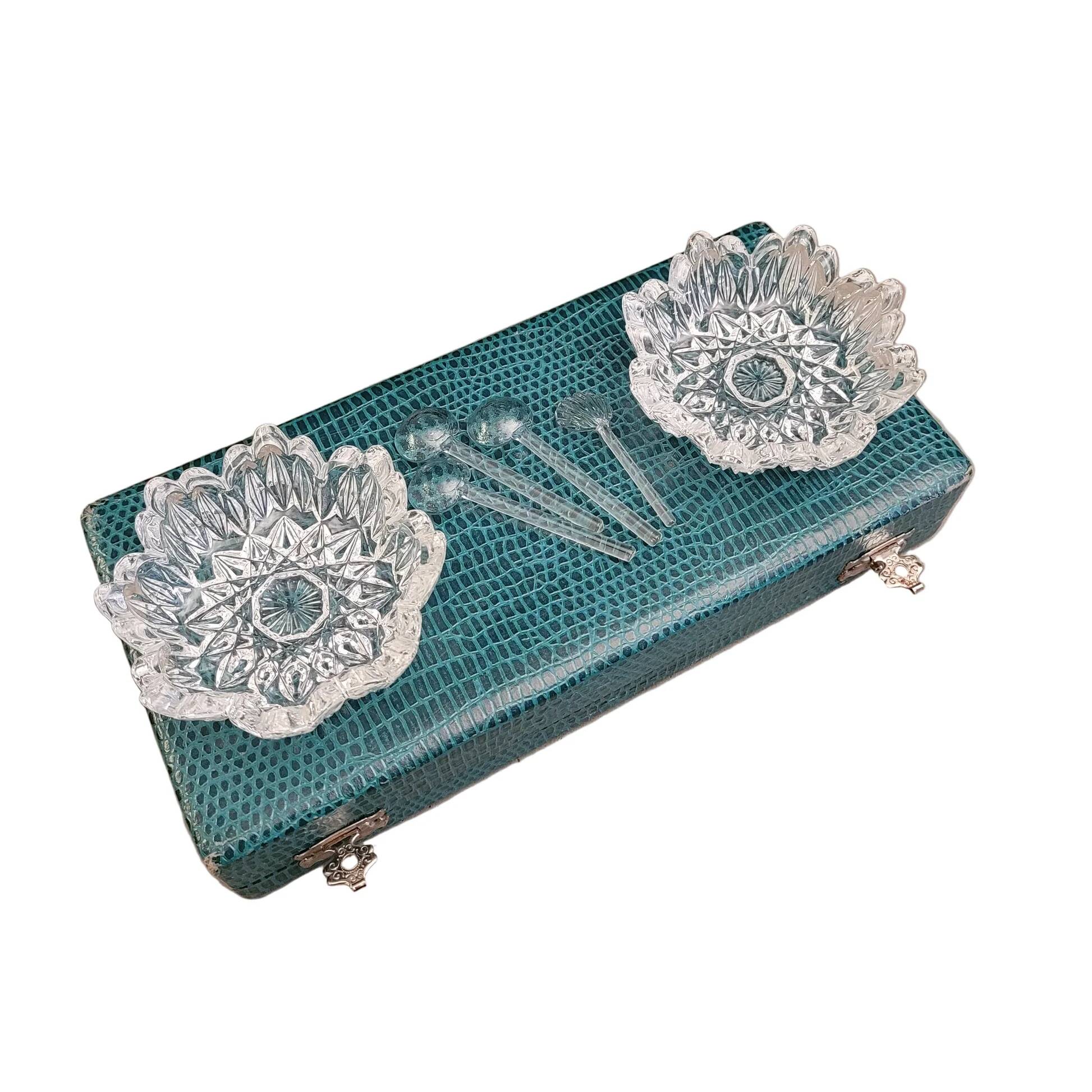 Pair of crystal salt cellars with spoons