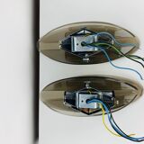 Pair of smoked glass and chrome wall lights from the 1970s.