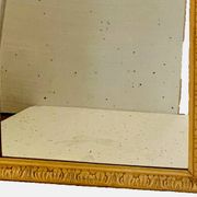Louis Philippe mirror in wood and patinated stucco, 19th century.