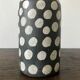 Terracotta vase painted with polka dots