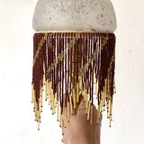Lampe en laiton et perles, style charleston