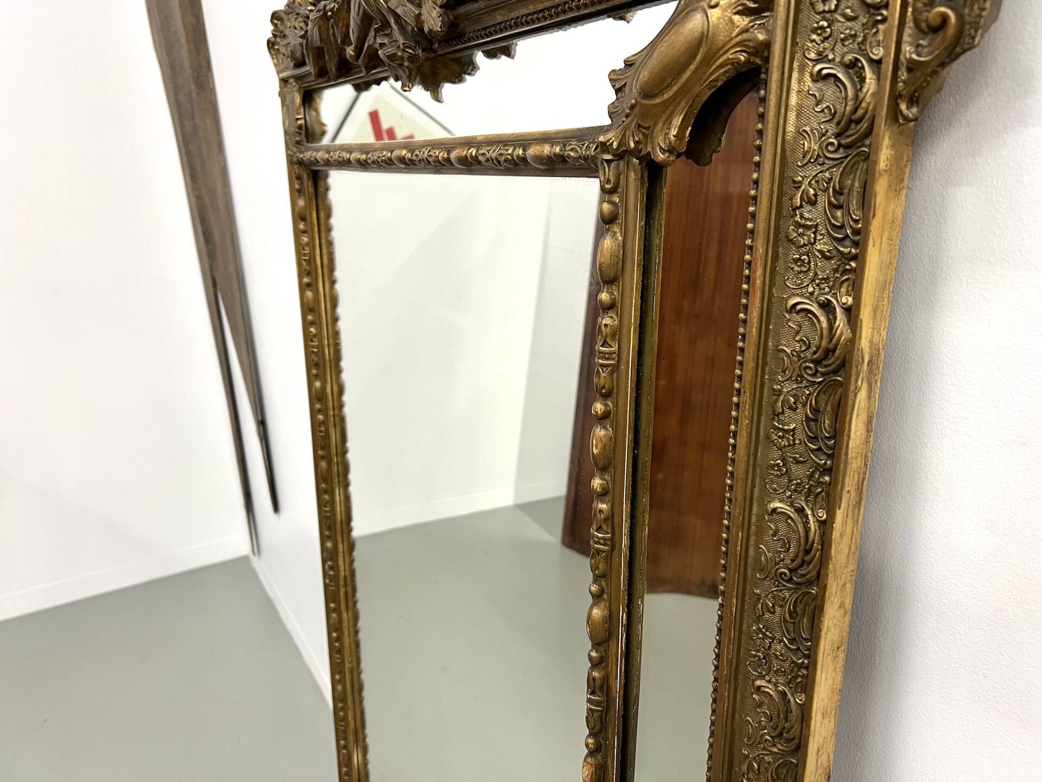 Large antique pediment mirror with mouldings.