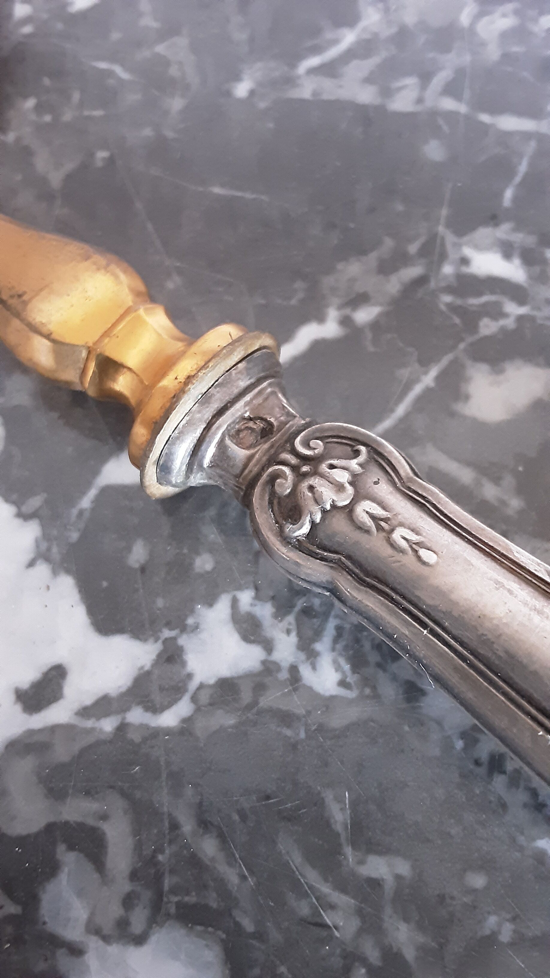 Old brass and silver pie shovel